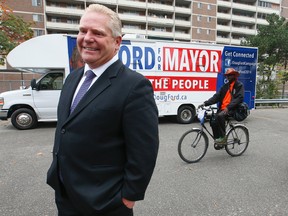 Toronto mayoral candidate Doug Ford in Regent Park talking to the residents of a TCHC building located at 275 Shuter St. on Thursday October 16, 2014. (Jack Boland/Toronto Sun)