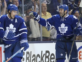 Toronto Maple Leafs left wing Joffrey Lupul (19) celebrates after tying the score in the third period with center Daniel Winnik (26) against the Colorado Avalanche at Air Canada Centre Oct. 14, 2014 The Maple Leafs won  3-2. (Tom Szczerbowski-USA TODAY Sports)
