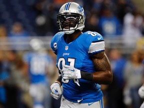 Detroit Lions wide receiver Calvin Johnson warms-up on the field before the start of their NFL football game against the Chicago Bears. REUTERS/Rebecca Cook