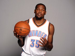 Oklahoma City Thunder forward Kevin Durant poses during media day at Chesapeake Energy Arena on September 29, 2014. (Mark D. Smith/USA TODAY Sports)