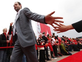 Ottawa Senators veteran Chris Phillips greets fans on the red carpet as he enters Canadian Tire Centre Thursday night. (Tony Caldwell/Ottawa Sun/QMI Agency)