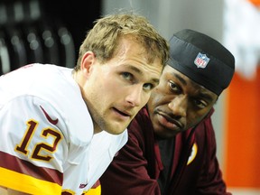 As soon as Robert Griffin III (left) returns from injury, fellow quarterback Kirk Cousins will be sent back to the Redskins bench. (AFP)