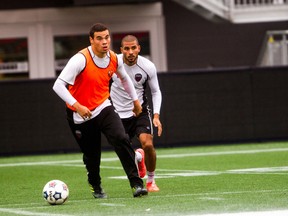 Ottawa Fury FC striker Vini Dantas, left, is pursued by Kenny Caceros at training Thursday at TD Place. Dantas is expected to start at home against Edmonton Sunday afternoon as top striker Tommy Heinemann will miss the match after being sent off last weekend in New York on two yellow card. (Chris Hofley/Ottawa Sun)