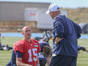 Argonauts coach Scott Milanovich chats with quarterback Ricky Ray, who was busy doing sprints at Thursday's practice. (DAVE THOMAS/TORONTO SUN)