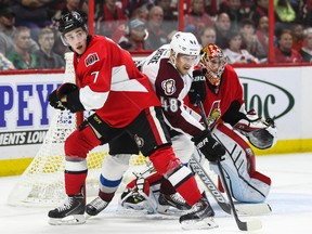 Ottawa Senators' Kyle Turris ties up Colorado Avalanche's Daniel Briere in front of netminder Craig Anderson during NHL hockey action at the Canadian Tire Centre Thursday. (Errol McGihon/Ottawa Sun/QMI Agency)