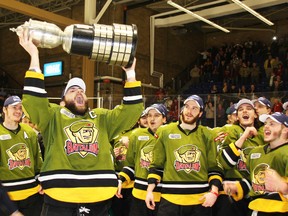 North Bay Battalion captain Barclay Goodrow hoists the Bobby Orr Trophy after sweeping the Oshawa Generals to win the Eastern Conference title at Memorial Gardens on April 23, 2014. (Dave Dale/QMI Agency)
