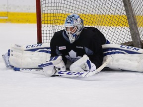 Leafs goalie Jonathan Bernier does the splits at practice yesterday. He has lost the starter’s job for now to James Reimer, who is a strong bet to be between the pipes versus Detroit tonight. (Craig Robertson/Toronto Sun)
