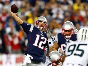 New England Patriots quarterback Tom Brady throws a pass against the New York Jets during the first half at Gillette Stadium on October 16, 2014. (Mark L. Baer/USA TODAY Sports)