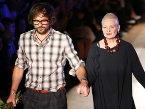 British designer Vivienne Westwood appears next to her husband Andreas Kronthaler at the end of her Spring/Summer 2015 women's ready-to-wear collection during Paris Fashion Week September 27, 2014.    REUTERS/Charles Platiau