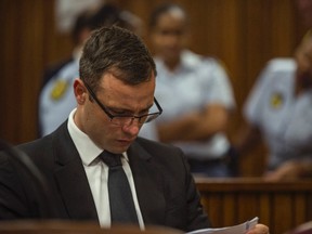 Olympic and Paralympic track star Oscar Pistorius attends his sentencing hearing at the North Gauteng High Court in Pretoria October 17, 2014. (REUTERS/Mujahid Safodien/Pool)