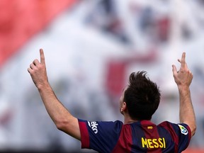 Barcelona's Argentinian forward Lionel Messi celebrates after scoring during the Spanish league football match Rayo Vallecano de Madrid vs  Barcelona on October 4, 2014.  (AFP PHOTO / DANI POZO)