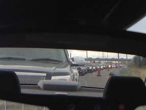 A massive traffic jam has developed Friday morning along Hwy. 417 and Palladium Dr., as shoppers try to get into the new Tanger Outlet Mall. (DANI-ELLE DUBE Ottawa Sun)