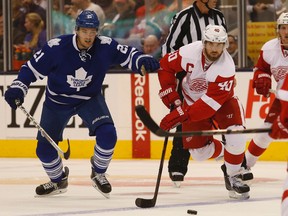 Maple Leafs James van Riemsdyk chases down Red Wings Henrik Zetterberg after the face-off during their pre-season game in Toronto on Saturday October 4, 2014. (Jack Boland/Toronto Sun)