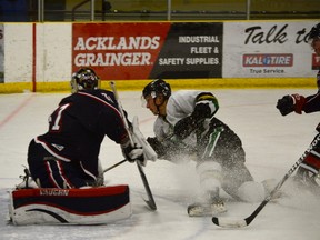 Aaron Tiessen of Sherwood Park plows through the Regals’ defence on Sunday night to hammer in one of the Knights’ seven goals against Jordan Greenfield. - Mitch Goldenberg, Reporter/Examiner