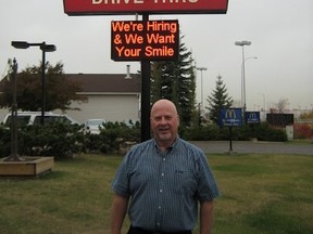 Eric Thys, franchise owner of three McDonald’s locations in the tri-area, stands under the golden arches in Spruce Grove. The sign says, “We’re Hiring and We Want Your Smile,” which says it all. Thys knows the labour shortage in Alberta is already here, and without the development of a sustainable long-term alternative to the temporary foreign workers program, it is only going to get worse. - Photo Supplied