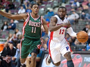 Detroit Pistons guard Will Bynum (12) dribbles the ball as Milwaukee Bucks guard Brandon Knight defends during the second quarter at The Palace of Auburn Hills. (Tim Fuller/USA TODAY Sports)