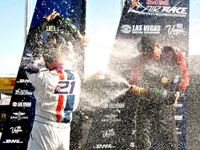 London Ont.-based air race pilot Pete McLeod celebrates his first place finish at Las Vegas Motor Speedway October 12, 2014 with pilots Nigel Lamb and Matthias Dolderer. CHRIS MONTANINI\LONDONER\QMI AGENCY