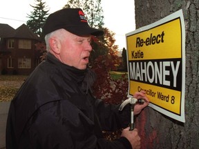 Don Cherry puts up a sign for Katie Mahoney in 1997. (Toronto Sun files)