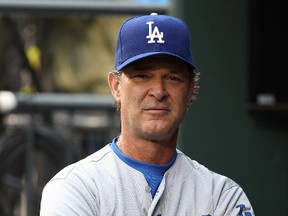 Don Mattingly's job as manager of the L.A. Dodgers is safe for next season. (Adam Hunger/USA TODAY Sports/Files)