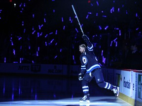 Winnipeg Jets forward Blake Wheeler is introduction before the team's NHL home opener against the Nashville Predators at MTS Centre in Winnipeg, Man., on Fri., Oct. 17, 2014. Kevin King/Winnipeg Sun/QMI Agency