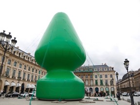 A view shows U.S. artist Paul McCarthy's 'Tree' creation which is displayed on the Place Vendome in this picture taken October 16, 2014 in Paris. REUTERS/Charles Platiau/Files