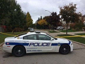 Peel Regional Police have cordoned off a section of Rainbow Cr., in Mississauga, as they investigate a deadly double stabbing that occurred early on Oct. 18, 2014. (CHRIS DOUCETTE/TORONTO SUN)