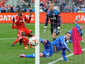 TFC's Doniel Henry cringes as his shot barely misses the Montreal net on Saturday at BMO Field. TFC and the Impact tied 1-1, leaving the Reds out of the playoffs for an eighth consecutive year. (DAN HAMILTON, USA TODAY SPORTS)