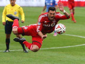 Gilberto flies through the air during Toronto FC’s draw with the Montreal Impact at BMO Field on Saturday. (VERONICA HENRI/TORONTO SUN)