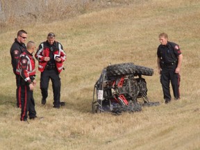 Police investigate after a woman crashed an ATV while exiting from Deerfoot Tr. onto Southland Dr. on Sunday afternoon. The woman was taken to hospital in life-threatening condition. MIKE DREW/CALGARY SUN/ QMI AGENCY
