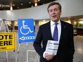 Mayoral candidate John Tory casts a ballot at an advance poll at City Hall  on Oct. 14. (CRAIG ROBERTSON, Toronto Sun)