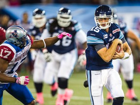 Argonauts quarterback Ricky Ray gets chased down by Billy Parker of the Montreal Alouettes on Saturday at the Rogers Centre. The Argos lost 20-12 and now need to beat the Als and Ticats the next two weeks to avoid missing the post-season. (ERNEST DOROSZUK/TORONTO SUN)