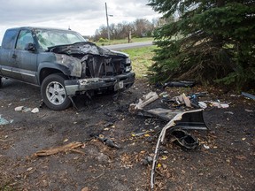 Suzanne Miller's mangled green pick-up truck still sits in her driveway among the debris of car parts, CDs and coffee cups, among other things. A fatal crash occurred on McCordick Road right on her front lawn on Saturday, Oct. 18. 2014.
DANI-ELLE DUBE/Ottawa Sun/QMI AGENCY