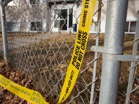 Edmonton Police Service officers continued to investigate a stabbing death in a suite at the Queen Mary Park Apartments at 10730 116 Street in Edmonton, Alta., on Sunday, Oct. 19, 2014. Police were called to the suite on Oct. 18. Ian Kucerak/Edmonton Sun/ QMI Agency