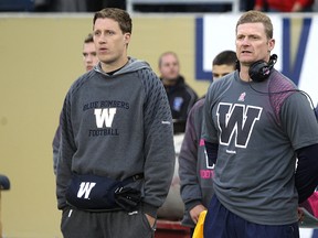 Winnipeg Blue Bombers QB Drew Willy and head coach Mike O'Shea stand on the sideline before facing the Calgary Stampeders during CFL action at Investors Group Field in Winnipeg, Man., on Sat., Oct. 18, 2014.