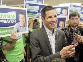 Mayoral candidate Brian Bowman speaks with reporters following a press conference in Winnipeg, Man. Sunday October 19, 2014.