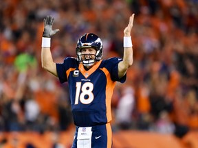 Denver Broncos quarterback Peyton Manning (18) reacts after throwing his second touchdown pass in the first quarter against the San Francisco 49ers at Sports Authority Field at Mile High. (Ron Chenoy-USA TODAY Sports)
