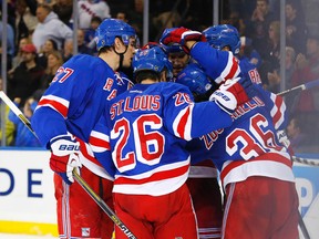New York Rangers right wing Martin St. Louis (26) celebrates his second period goal with his teammates against the San Jose Sharks during the second period at Madison Square Garden. (Andy Marlin-USA TODAY Sports)