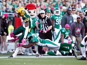 Eskimos slotback Adarius Bowman gets tackled by Saskatchewan Roughriders' Tristan Jackson in Regina, Saskatchewan October 19, 2014. The Eskimos won the game 24-19. REUTERS/David Stobbe (CANADA - Tags: SPORT FOOTBALL)