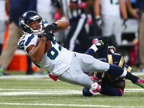 Seahawks receiver Doug Baldwin gets tackled against the Rams in St. Louis yesterday.  (afp)