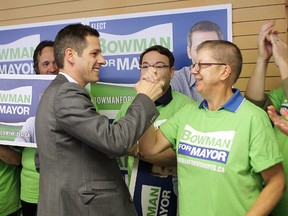 Mayoral candidate Brian Bowman high fives a supporter during a press conference on Sunday. Bowman has reason to celebrate: he's leading in the polls for the first time with only two days left before election day. (Brian Donogh/Winnipeg Sun)