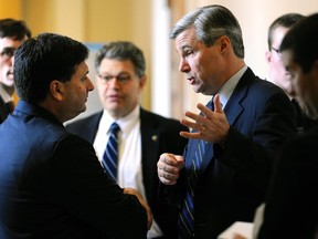 U.S. Senator Sheldon Whitehouse (D-RI) (R) talks to Ron Klain (L), then-chief of staff for U.S. Vice President Joe Biden, outside of the senate Democrats' weekly policy lunch at the U.S. Capitol in Washington, in this Dec. 8, 2009 file photo. REUTERS/Jonathan Ernst/Files