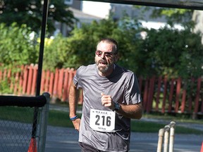 Michael Verstappen runs in the WAMBO River Run in August 2013. Ever since the Wallaceburg man was diagnosed with diabetes in April 2012, he has used running and a regimented diet to lose over 100 pounds and control his diabetes. (File photo)