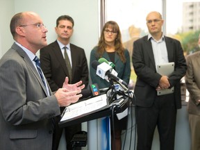 Mayoral candidate Matt Brown addresses the media after earning public endorsements from local business leaders George Kerhoulas, Erin Rankin Nash, David Billson and Paul Mansell, at a press conference at the candidate's Commissioners Road campaign headquarters in London on Monday October 20, 2014.  (CRAIG GLOVER, The London Free Press)