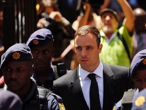 South African Olympic and Paralympic sprinter Oscar Pistorius leaves the North Gauteng High Court in Pretoria, October 17, 2014. (REUTERS)