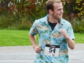 Alex Cardno, of Seaforth, crosses the finish line, placing first in the 5k run with a time of 28:59.