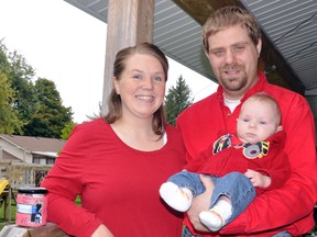 Heather and Jason Bauer, with infant son Andrew, last week donated $824.55 to the Ronald McDonald House Charities and their awareness day. The Mitchell family was so thrilled to stay at the Ronald McDonald House in London when Andrew was born in July, they decided to raise both awareness and funds over the Thanksgiving season. ANDY BADER/MITCHELL ADVOCATE