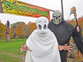 Bert Vorstenbosch (front), dressed as a ghost, and Optimist Wayne Krug, as the Grim Reaper, practice their scary skills as they await visitors to the Mitchell Optimist Club and the Vorstenbosch family’s 5th 'Spooktacular' event this Saturday, Oct. 25 and Sunday, Oct. 26, between 1-4 p.m. Admission is by donation, with proceeds going to the Stratford-Perth Museum Children's Education Division and various club projects. KRISTINE JEAN/MITCHELL ADVOCATE