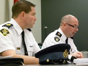 Quinte West OPP Staff Sgt. Dave Tovell and Detachment Commander, Insp. Mike Reynolds listen as the results of the new OPP funding formula were announced at the police services board meeting held Monday. Quinte West’s policing bill will drop by $2.2 million over the next five years. - Ernst Kuglin/The Intelligencer