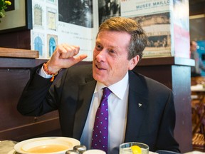 Mayoral candidate John Tory has lunch with Toronto Sun columnist Sue-Ann Levy at the Bloor Street Diner in Toronto, Ont. on Monday, October 20, 2014. (Ernest Doroszuk/Toronto Sun)