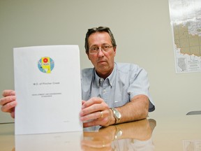 Leo Reedyk, director of operations for the MD of Pincher Creek, holds a copy of the recently implemented engineering and development standards. The document, produced over the last three years, combines a number of standards and drawings formerly from different policies all in one place. John Stoesser photos/QMI Agency.